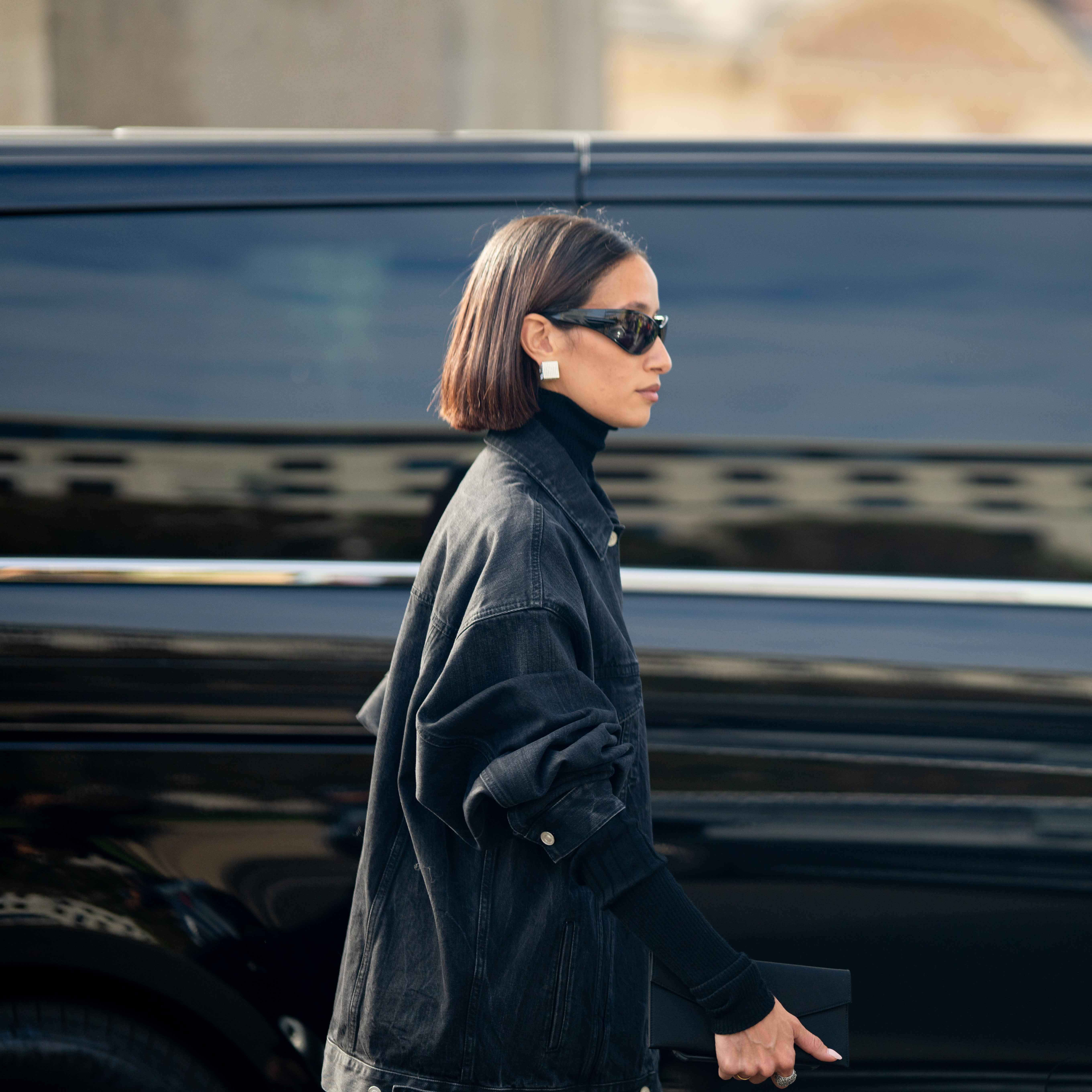 Alexandra Guerain Wearing Black Denim Jacket With Polo Neck Jumper After Givenchy SS24 Paris Fashion Week Street Style.