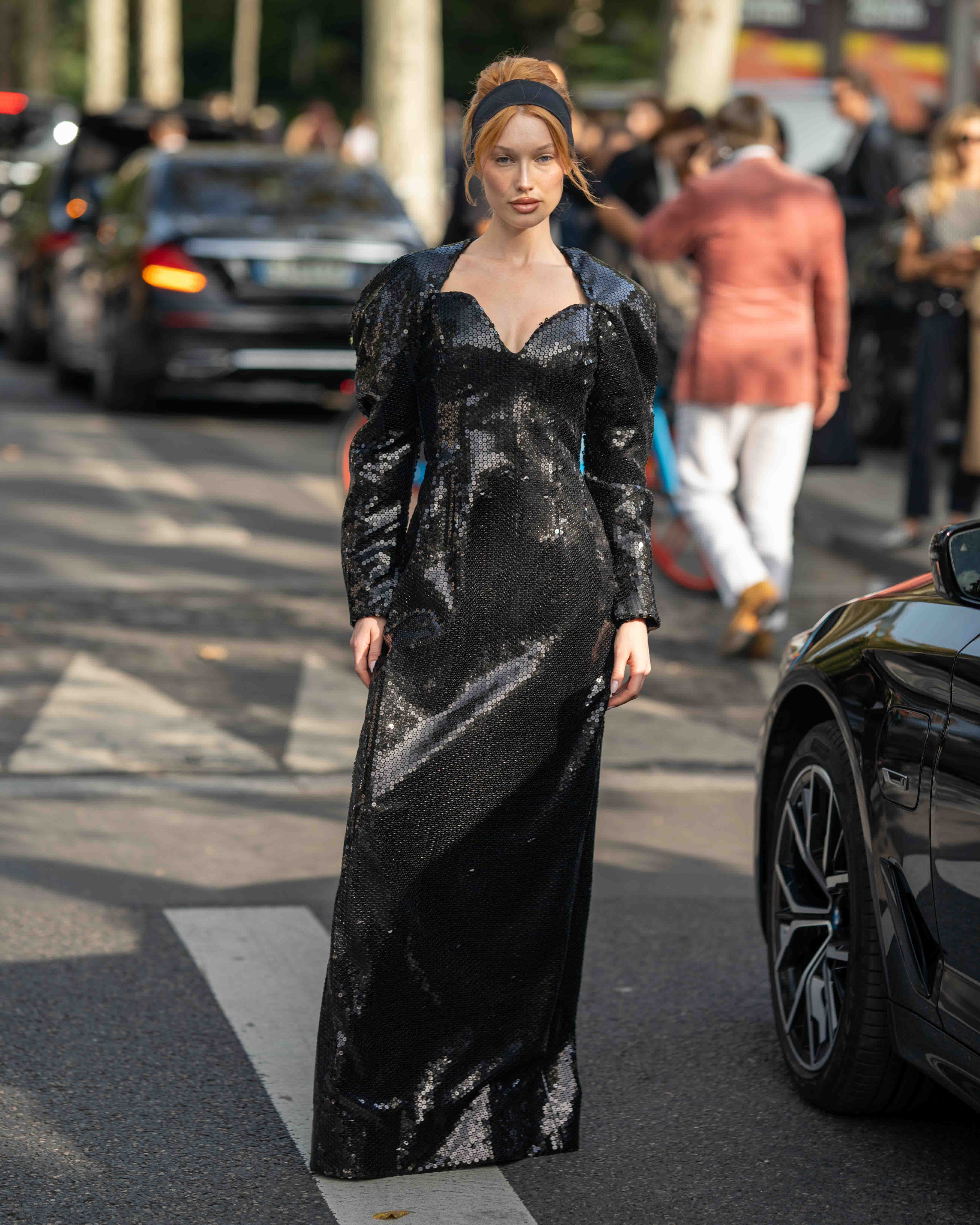 Meredith Duxbury wears a floor length black sequin dress After Nina Ricci SS24 Paris Fashion Week Street Style 