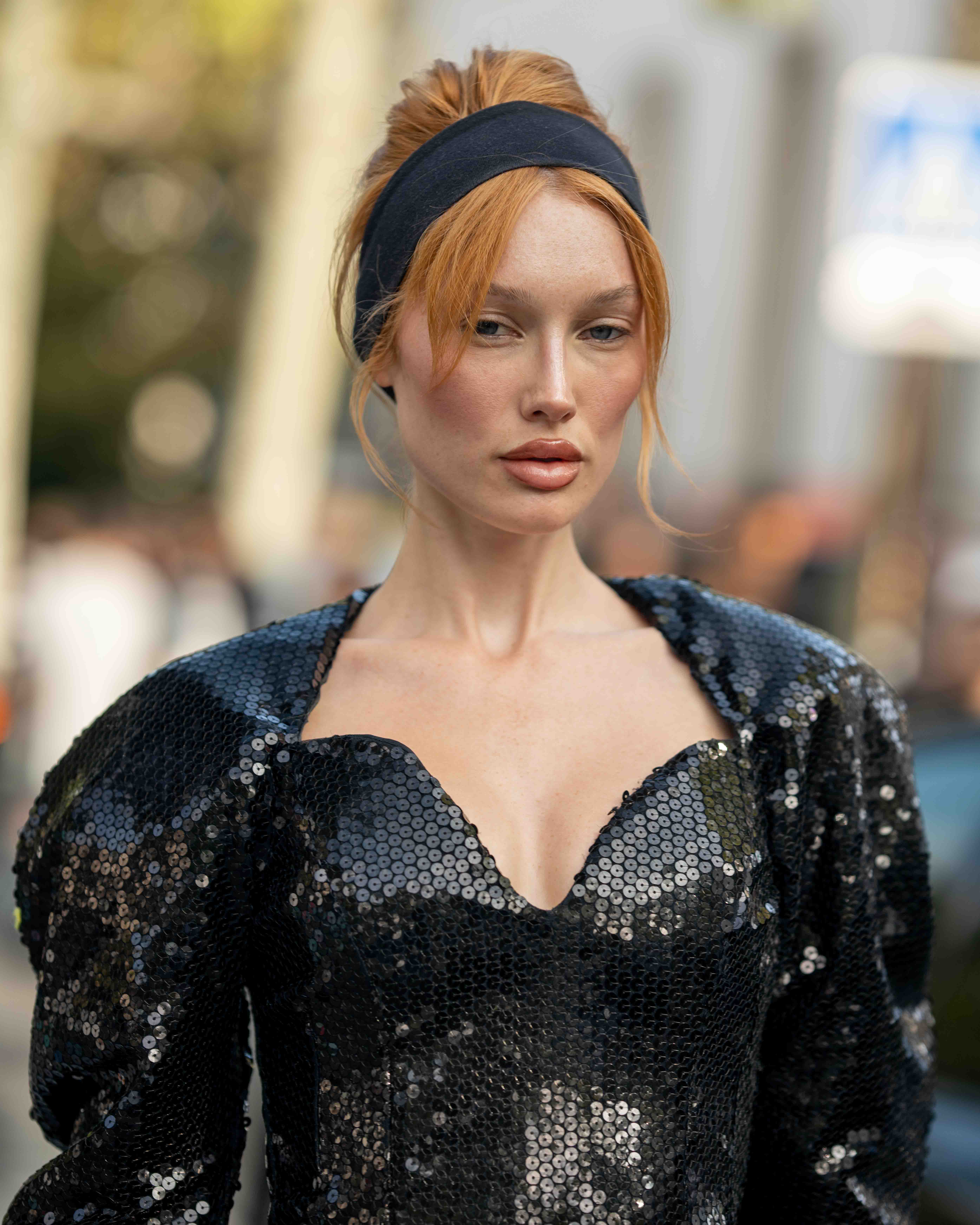 Portrait of Meredith Duxbury wearing a floor length black sequin dress After Nina Ricci SS24 Paris Fashion Week Street Style 