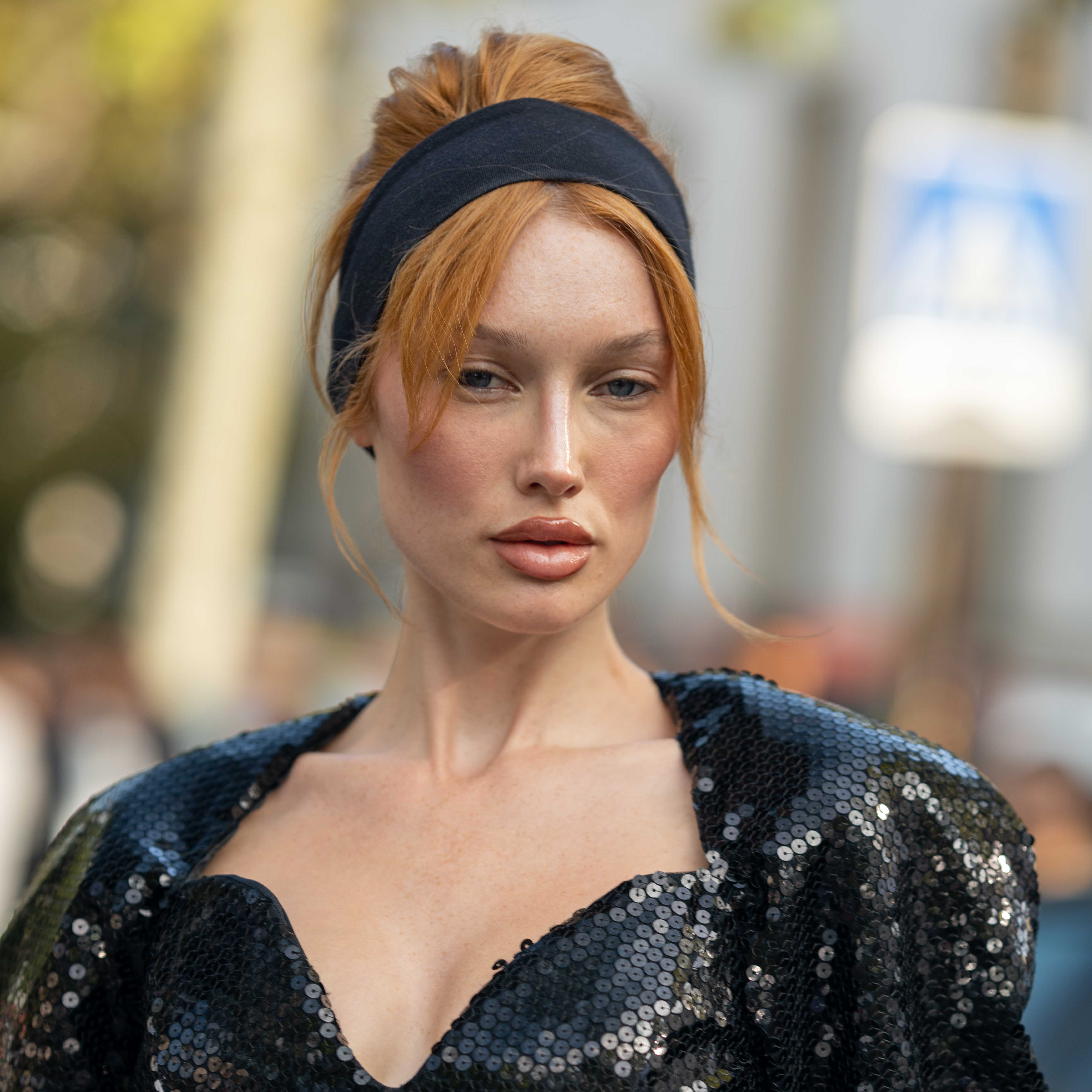 Portrait of Meredith Duxbury wearing a floor length black sequin dress After Nina Ricci SS24 Paris Fashion Week Street Style 